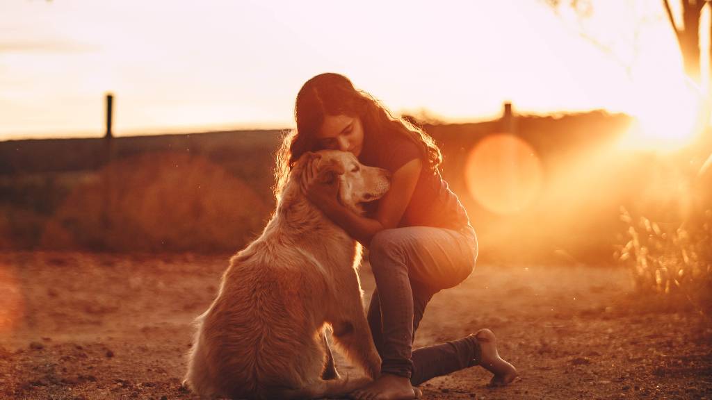 child hugging emotional support dog